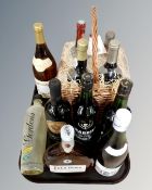 A tray containing a John Lewis four bottle wine gift set in wicker basket together with seven