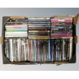 A box of DVD's relating to music to include Led Zeppelin, AC/DC, Mike Oldfield, Taylor Swift,