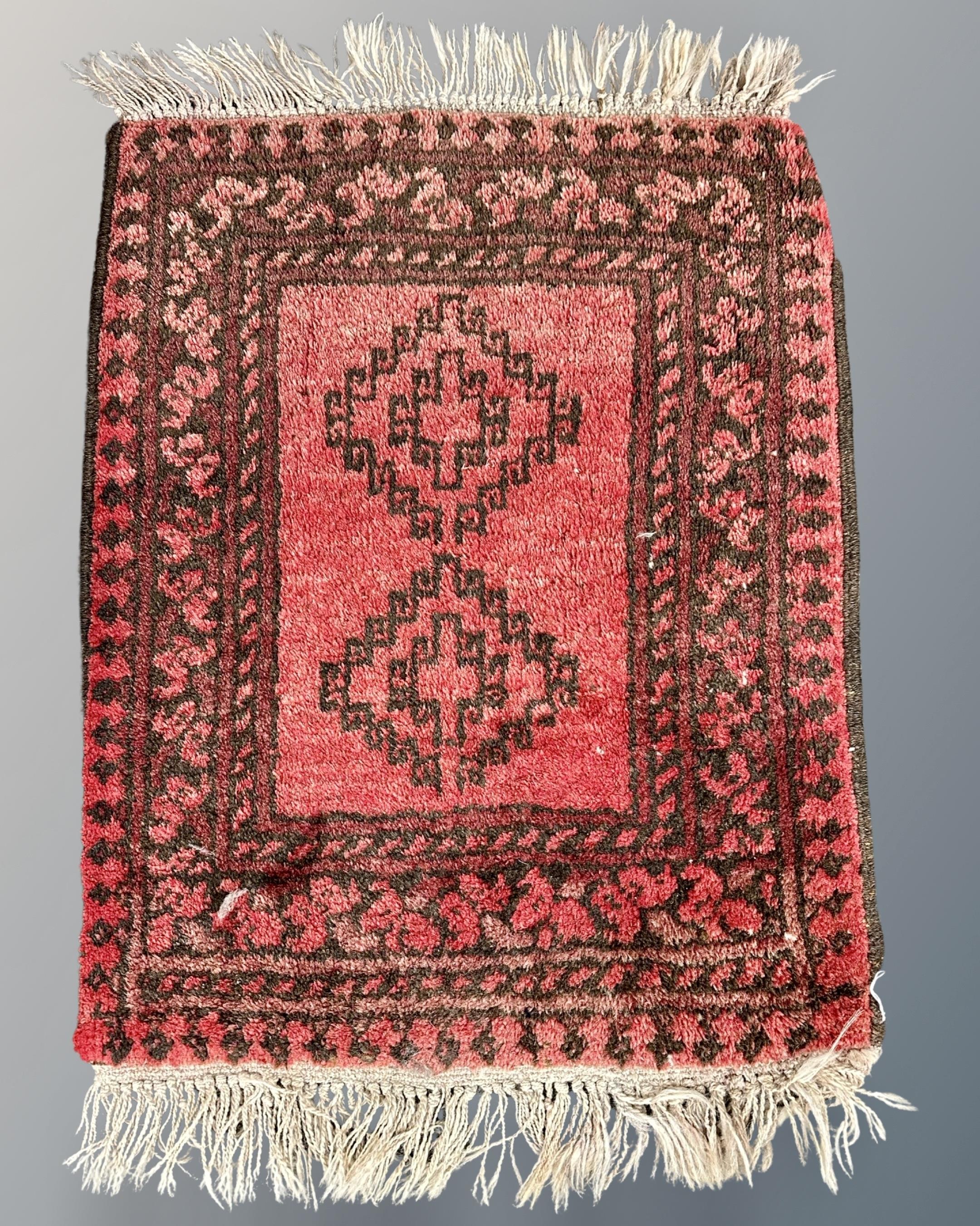 A small Bokhara rug, Afghanistan, 52cm by 64cm.