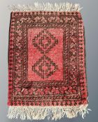 A small Bokhara rug, Afghanistan, 52cm by 64cm.