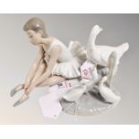 A Nao china figure : Seated Ballerina, height 13 cm,
