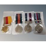 Four middle eastern medals on ribbons