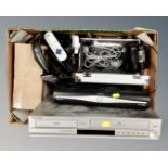 A box containing assorted electricals including Samsung DVD/VCR recorder, Sky+ HD box,