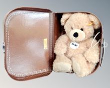 A Steiff Fynn bear in miniature suitcase