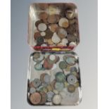 Two tins containing a quantity of 19th and 20th century British and Middle Eastern coinage.