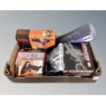 A box containing Coyote Sports cycle helmet, Black and Decker 18v electric drill,