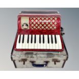 A La Tosca Primo piano accordion in case.