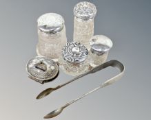 Three silver topped cut glass dressing table jars, together with a further dressing table jar,