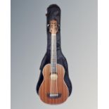 A Countryman model UB electric bass ukulele in carry bag