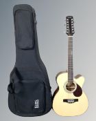 An Adam Black model 0-5CE-12/N 12-string semi-acoustic guitar in carry case
