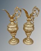 A pair of 19th century gilt metal ewers.