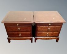 A pair of Stag Minstrel two drawer beside chests with slides