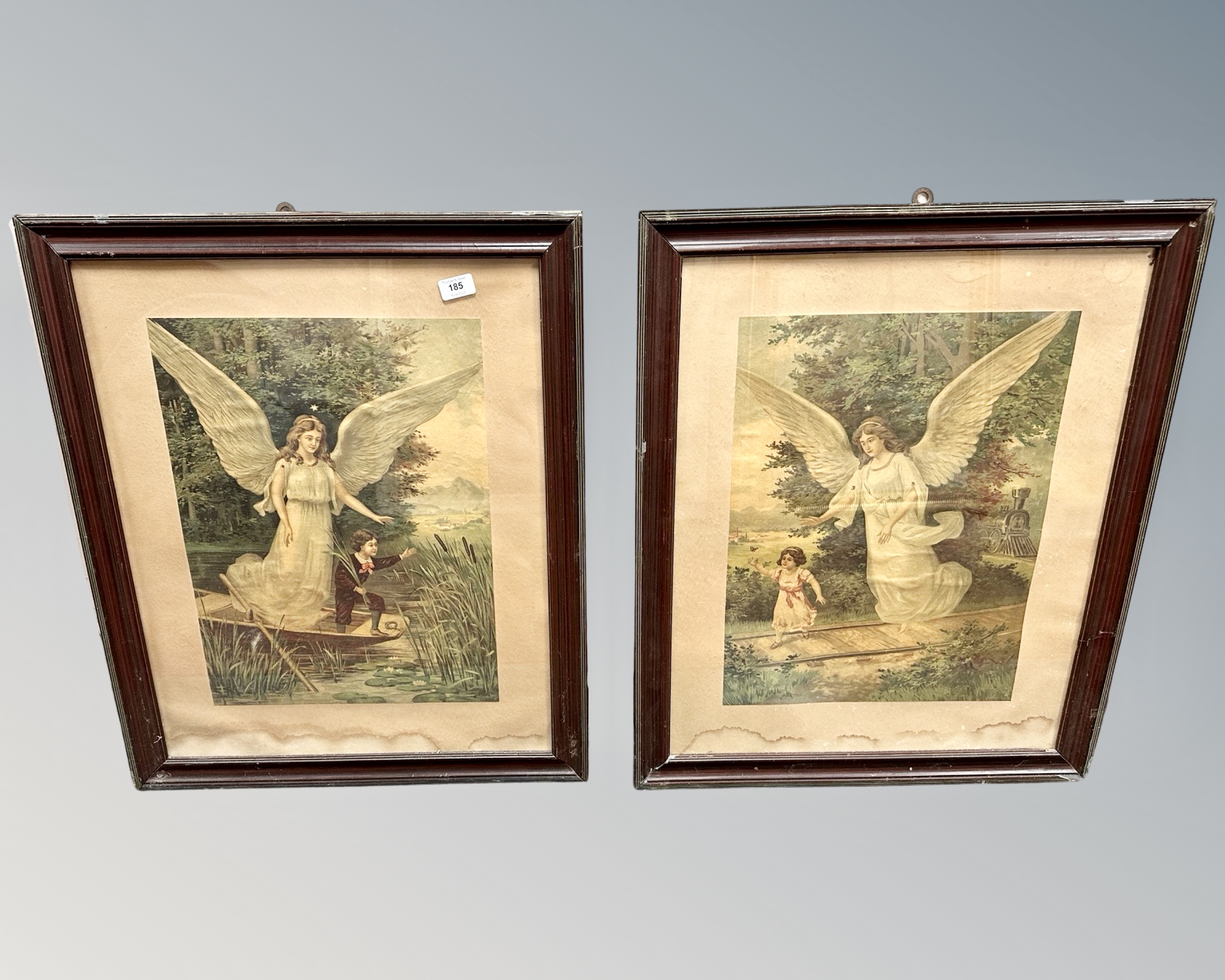 A pair of chromolithographic prints depicting angels,