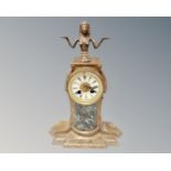 A 19th century painted metal and marble 24 hour mantel clock surmounted by an Egyptian figure