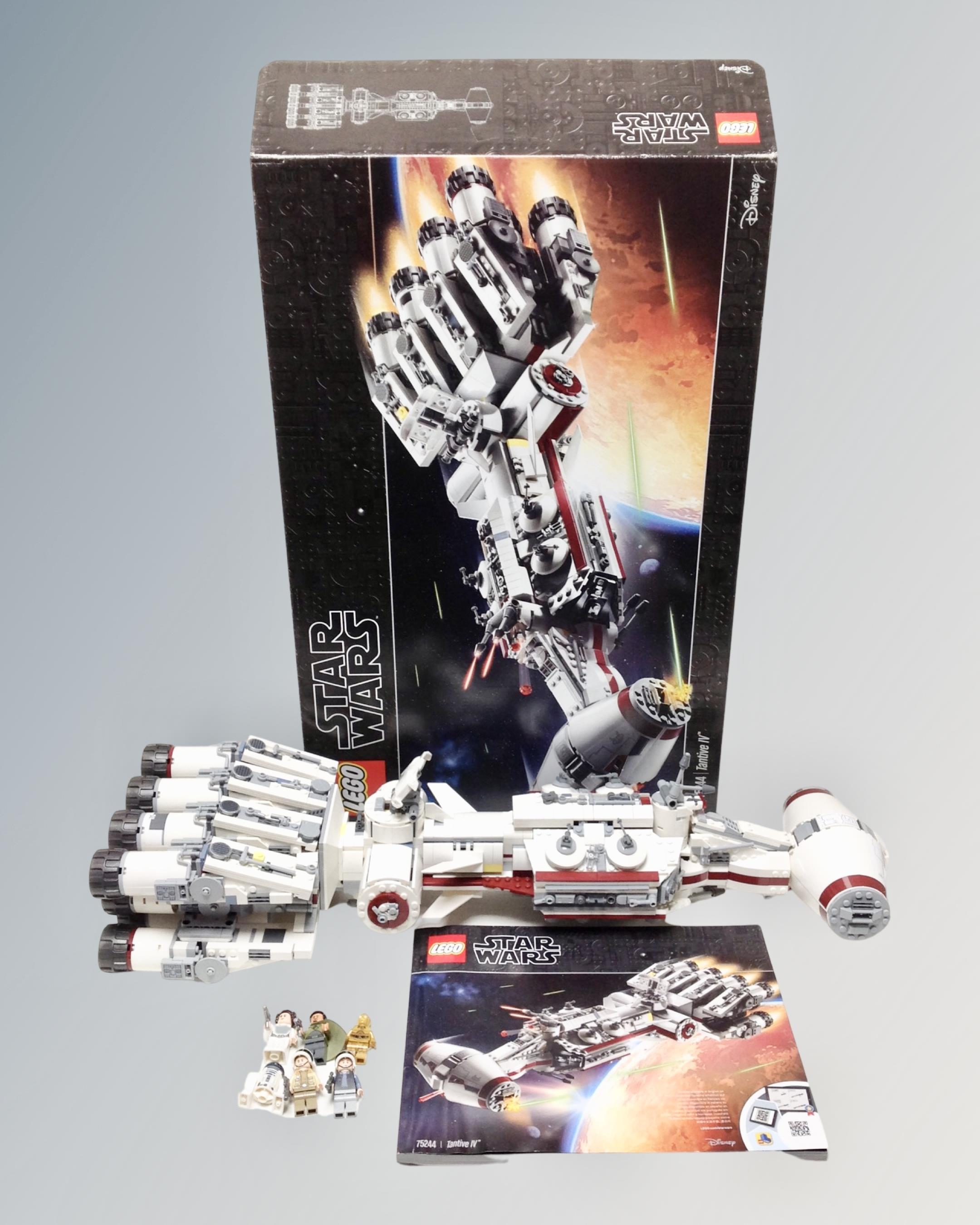 A Lego Star Wars 75244 Tantive IV with mini-figures, box and instructions.