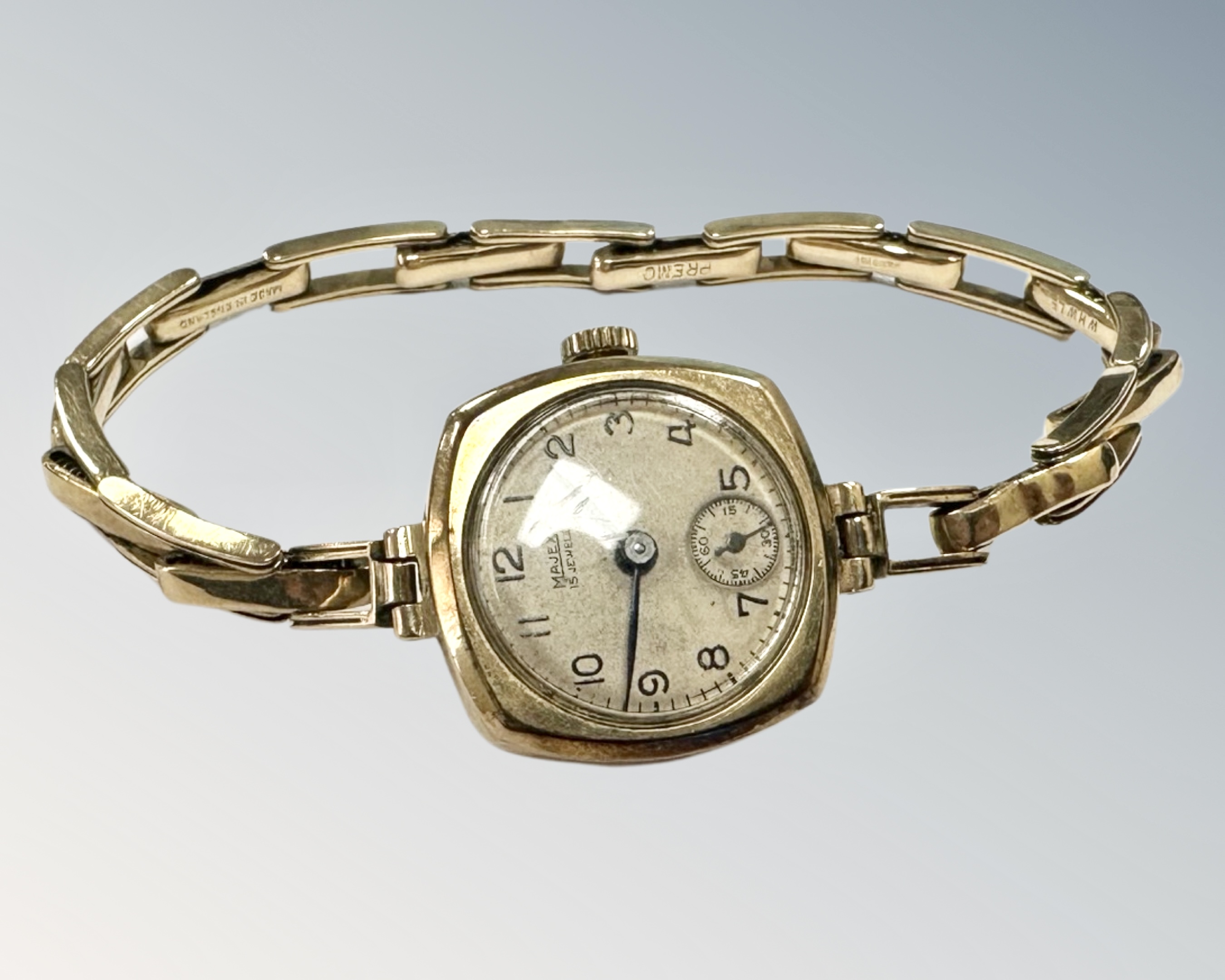 A lady's 9ct gold wristwatch on 9ct gold expansion strap CONDITION REPORT: 16.