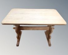 A continental blonde oak refectory dining table,