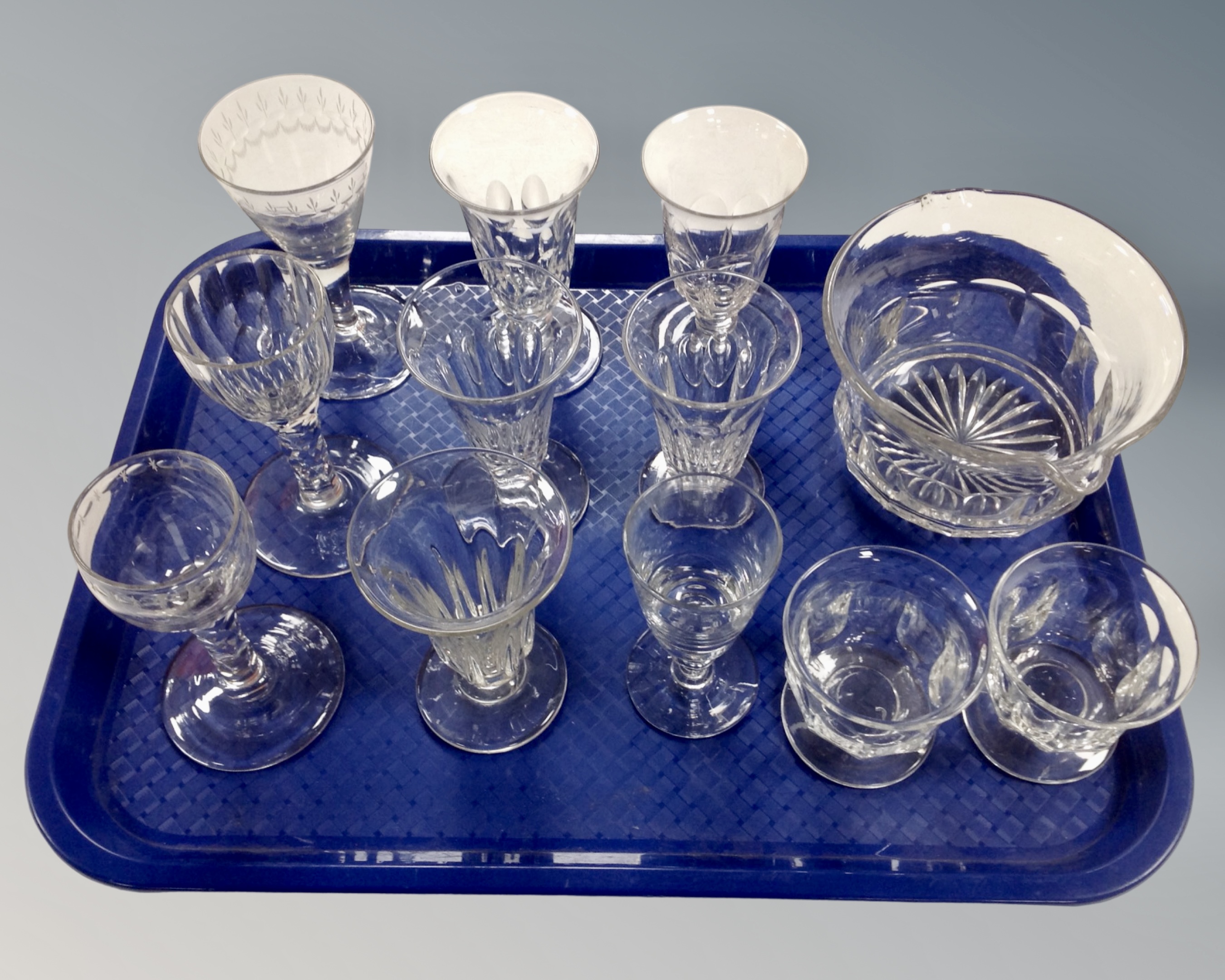 A tray containing 12 pieces of 19th century glassware including Georgian facet stem liqueur glasses,