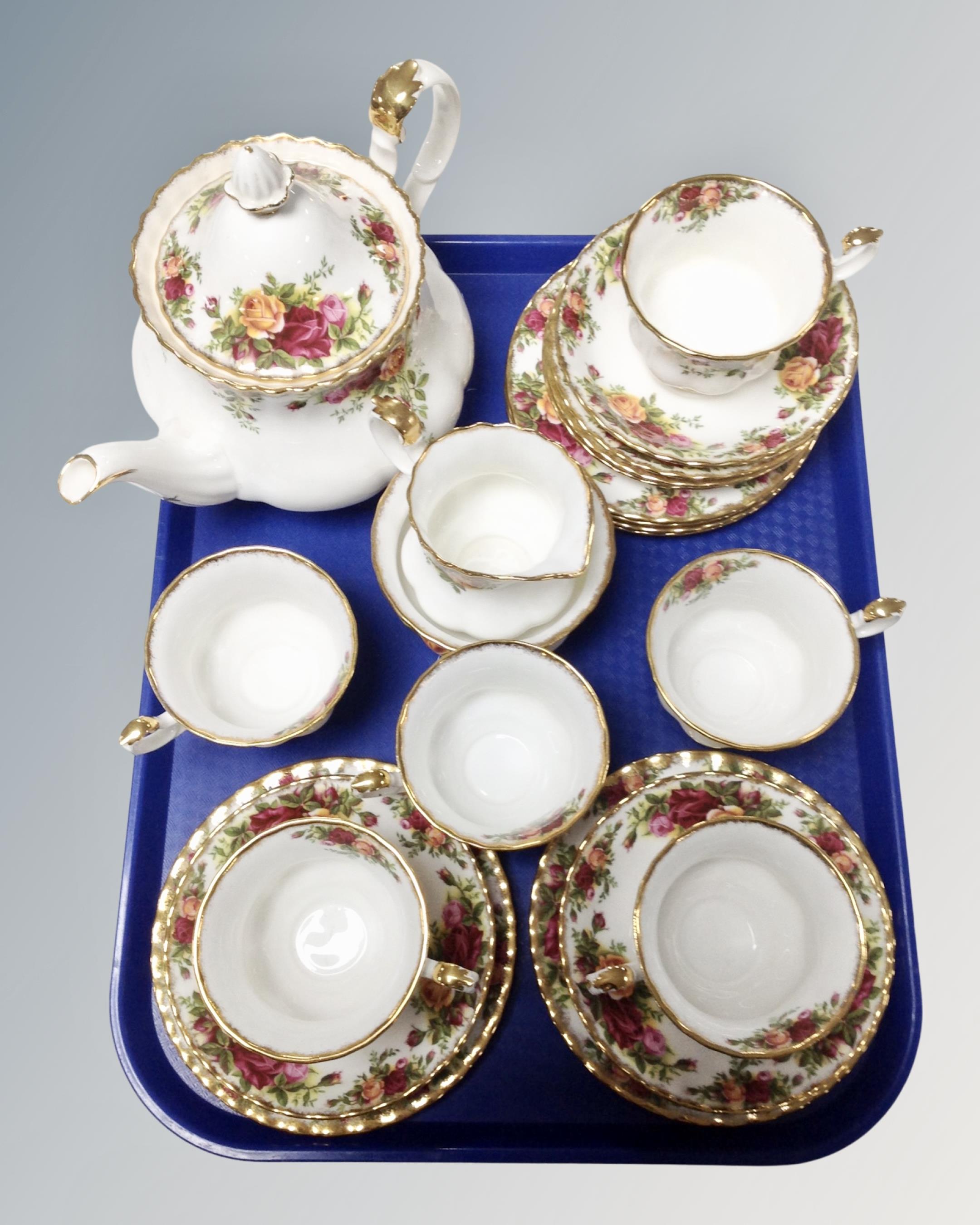 A tray containing twenty-one pieces of Royal Albert Old Country Roses tea china.