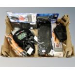 A box of new cycling accessories to include bike locks, gel seats, accessory pack,
