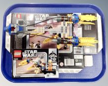 A Lego Star Wars 75258 Anakin's Pod Racer 20th Anniversary edition, with mini-figures,