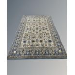 A machine-made Tabriz design rug, 201cm by 297cm.