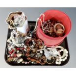 A tray containing a good collection of costume jewellery including bangles, necklaces etc.