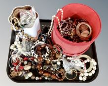 A tray containing a good collection of costume jewellery including bangles, necklaces etc.