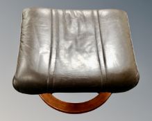A Scandinavian brown leather footstool