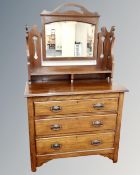 An Arts and Crafts three drawer dressing table