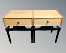 A pair of mid 20th century bedside tables fitted a drawer with black lacquered legs