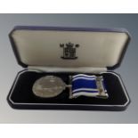 A Royal Mint police long service and good conduct medal on ribbon