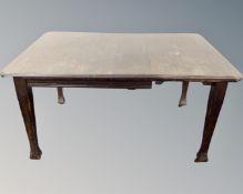 A 19th century oak wind out table.