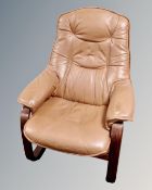 A Scandinavian tan leather bentwood armchair