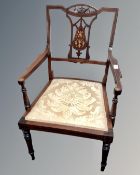 An Edwardian inlaid mahogany open armchair