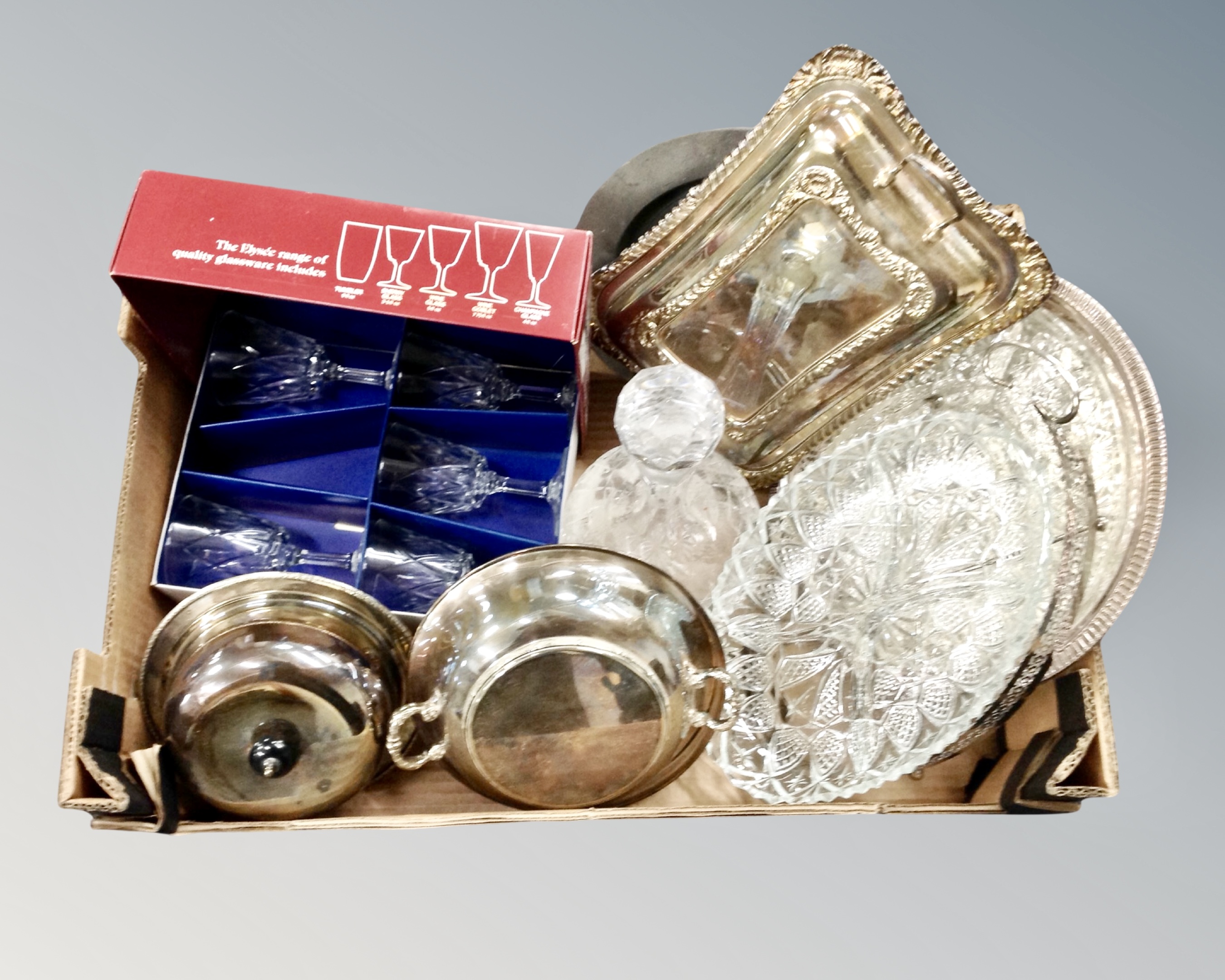 A box containing plated tureens, glass hors d'oeuvres dishes, boxed wine glasses and decanter.