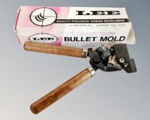 A Lee bullet casting mold, boxed.
