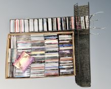 Two metal CD racks together with a box containing a large quantity of CDs including AC/DC,