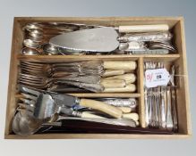 A wooden four-compartment cutlery tray containing a quantity of various silver plated table ware :