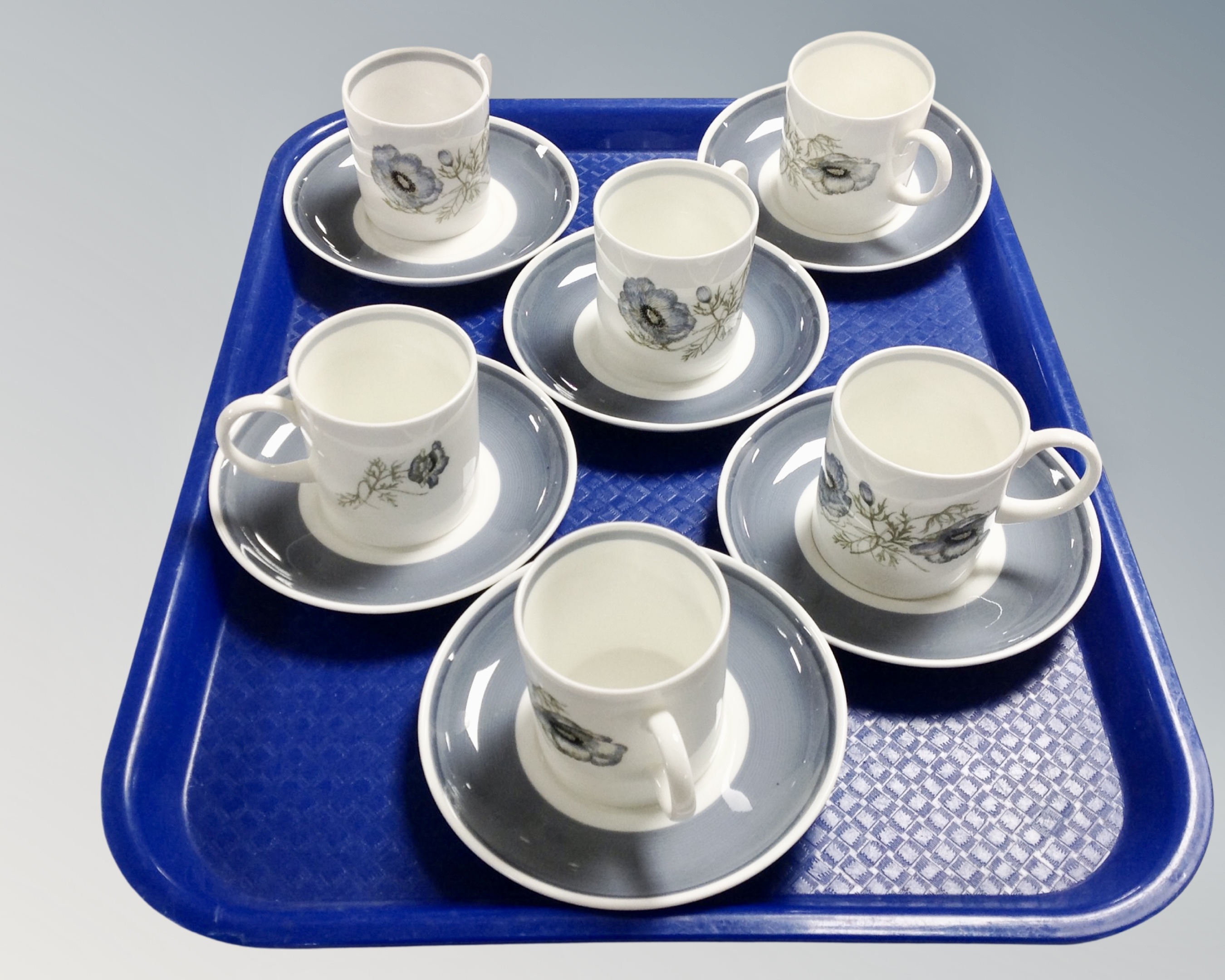 A set of six Wedgwood Susie Cooper design coffee cans with saucers.