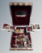 An Asian style metal-bound jewellery box in the form of a book containing a good collection of