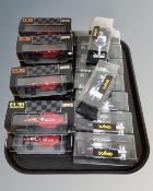 A tray containing 19 Onyx Formula 1 model cars in boxes and display cases.