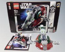 A Lego Star Wars 75243 Slave I 20th Anniversary edition with mini-figures, box and instructions.