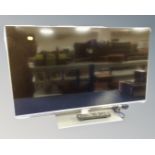 A Panasonic TX-L39E6B LCD TV with remote