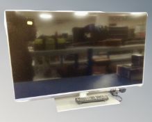 A Panasonic TX-L39E6B LCD TV with remote