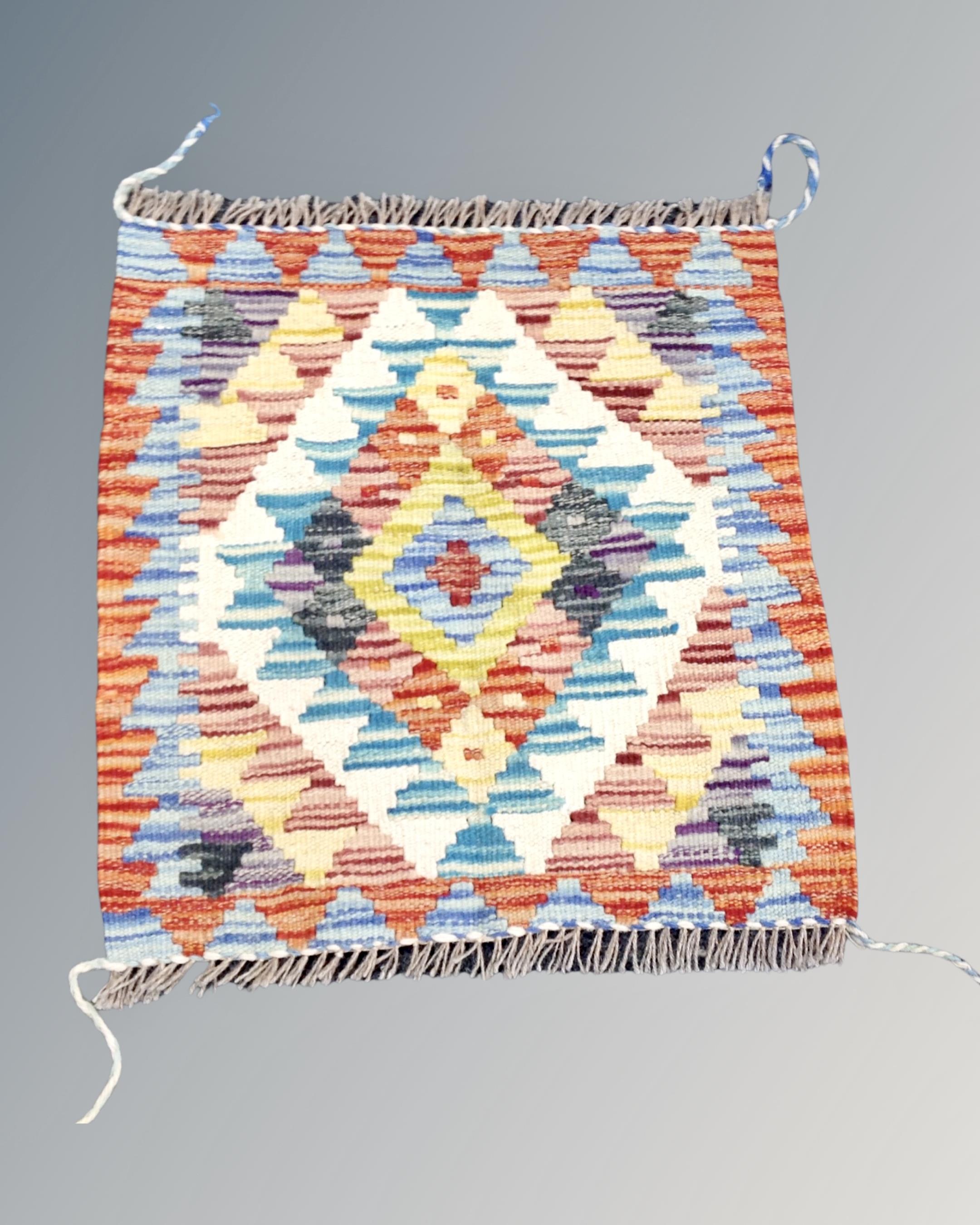 A Chobi kilim 48cm by 46cm