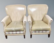 A pair of armchairs in studded beige vinyl