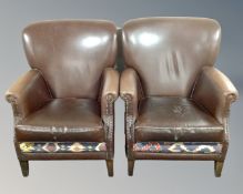 A pair of armchairs in studded brown vinyl