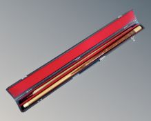 A two piece snooker cue in Riley case.