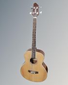 A Woodstock model WHBASSEQ203 semi-acoustic bass guitar